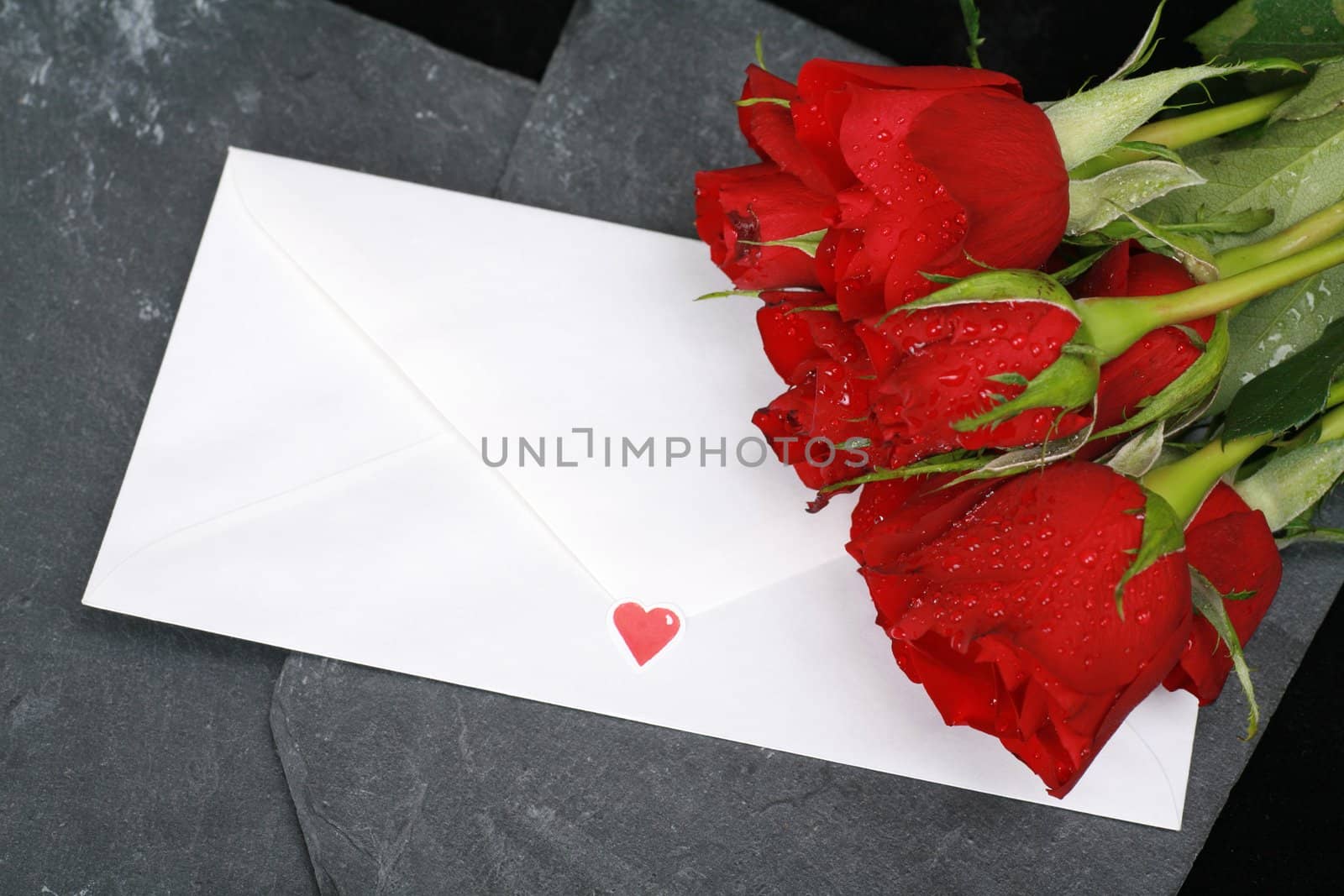 a loveletter on a dark background with rose and heart...........