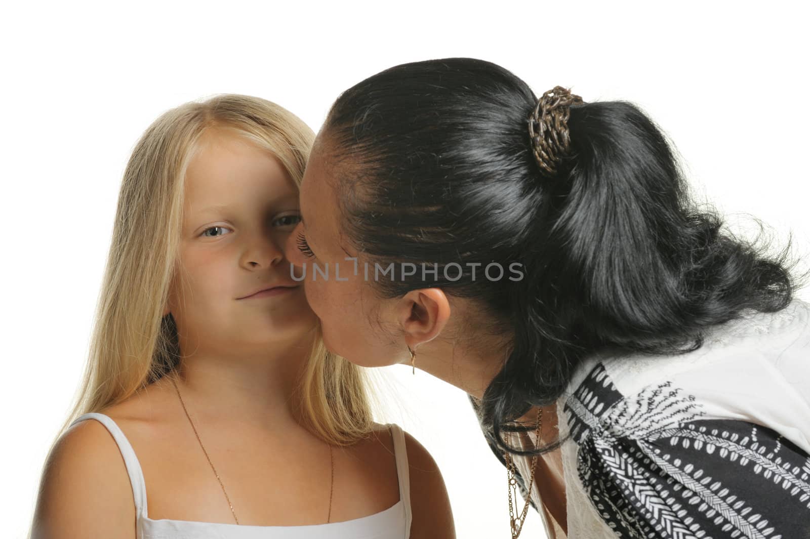 Mum kisses the daughter. It is isolated on a white background