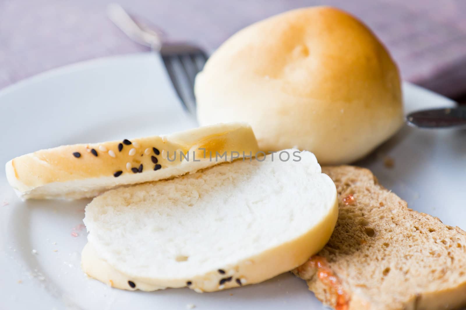 Bread in the dish on the dining table. by Na8011seeiN