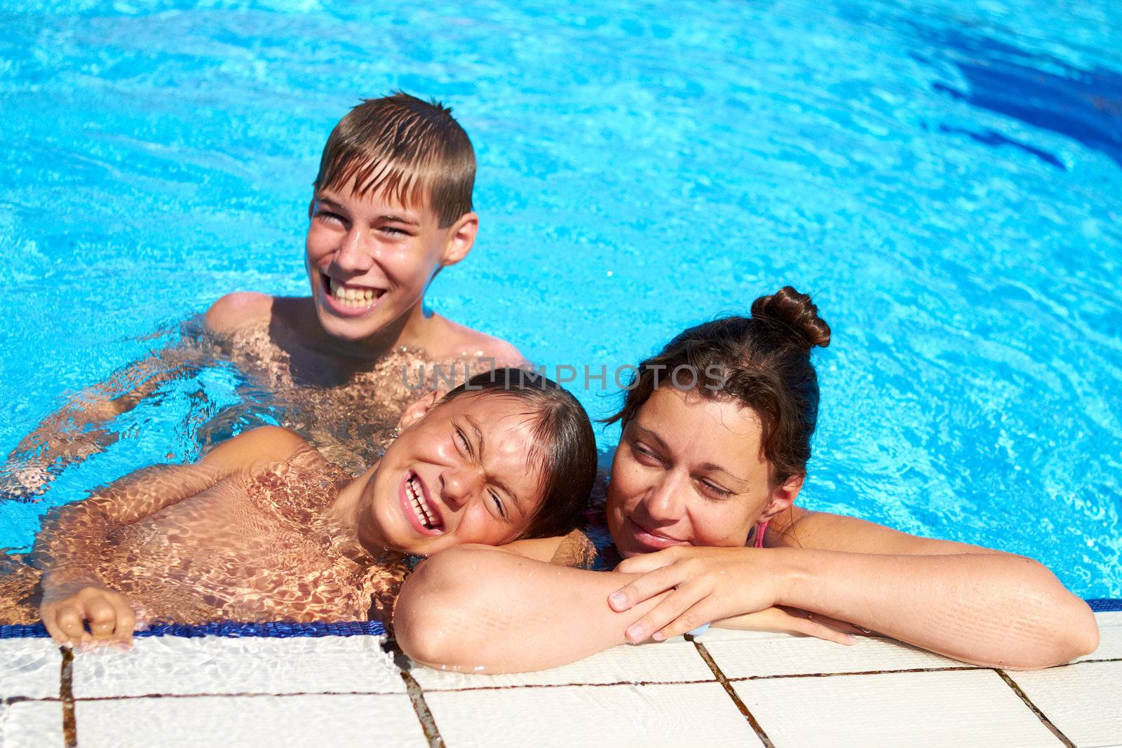 Happy family have relax in swimming pool