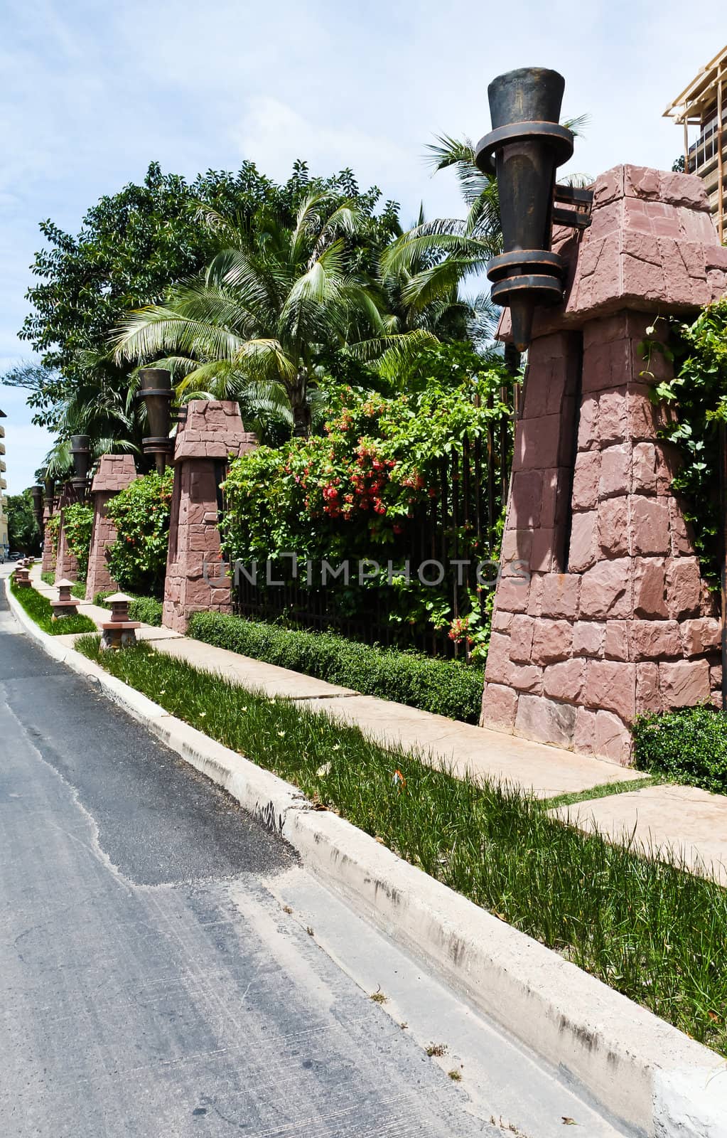 Walkway beside the fence, steel and stone walls of the hotel. by Na8011seeiN