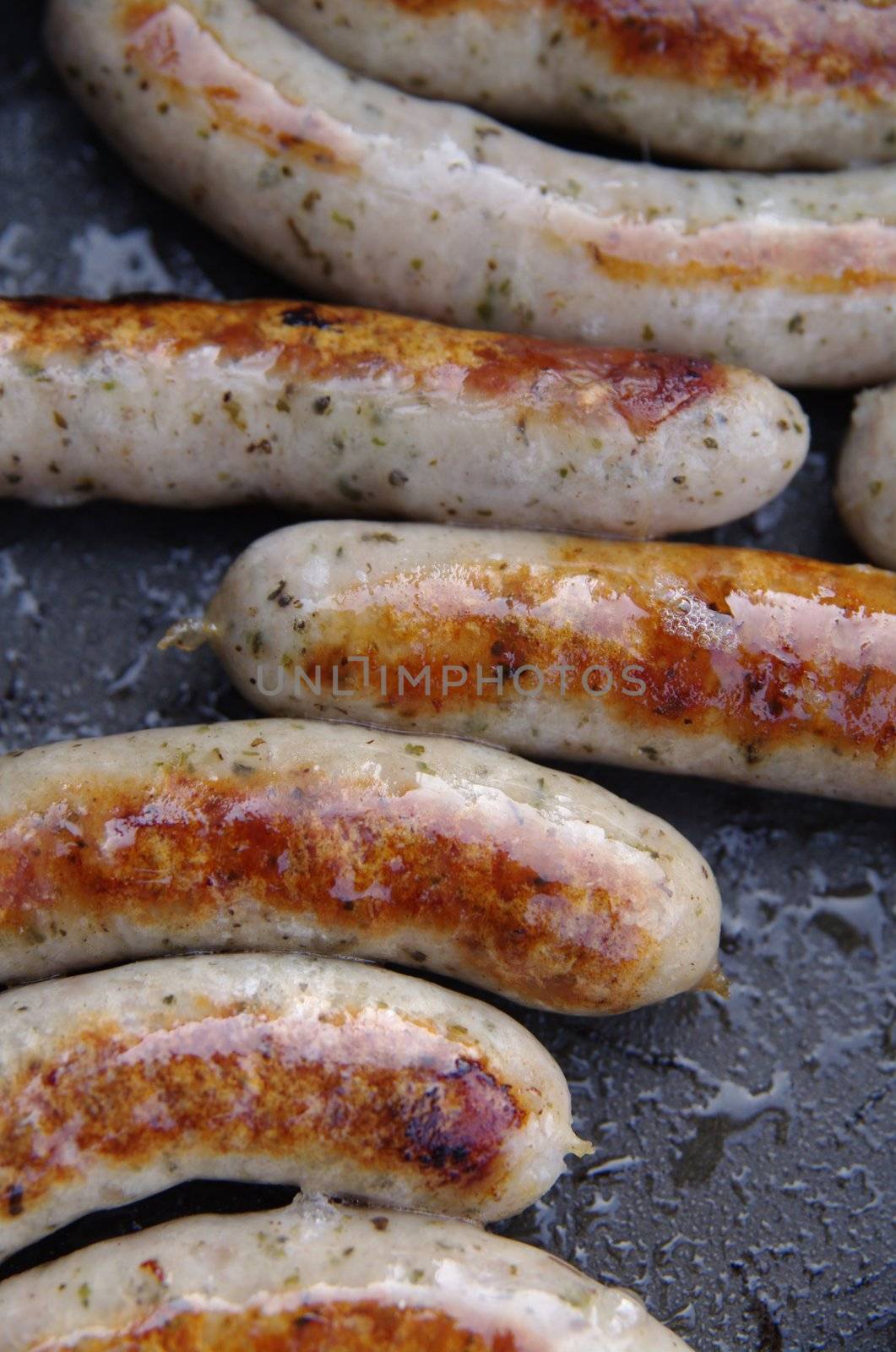 a sausage grilled on a camp fire