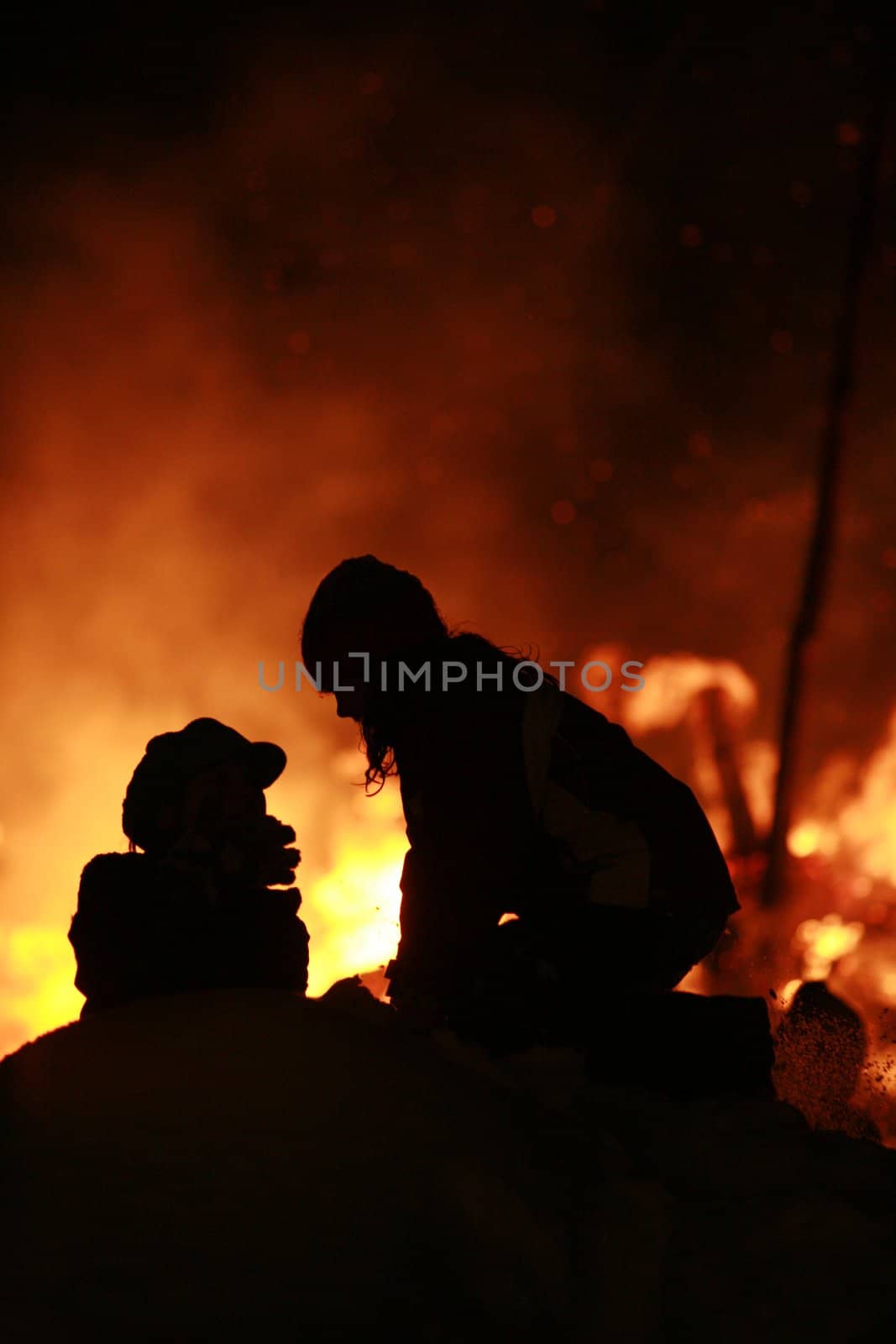 Close-up of some people coming out of fire