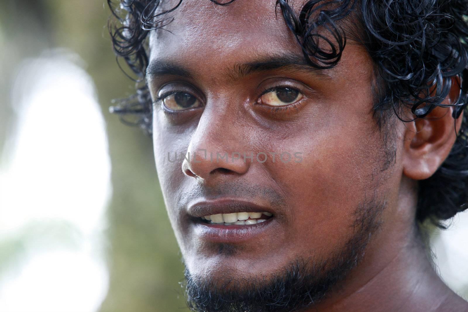 Portrait young men on a green background. Sri Lanka