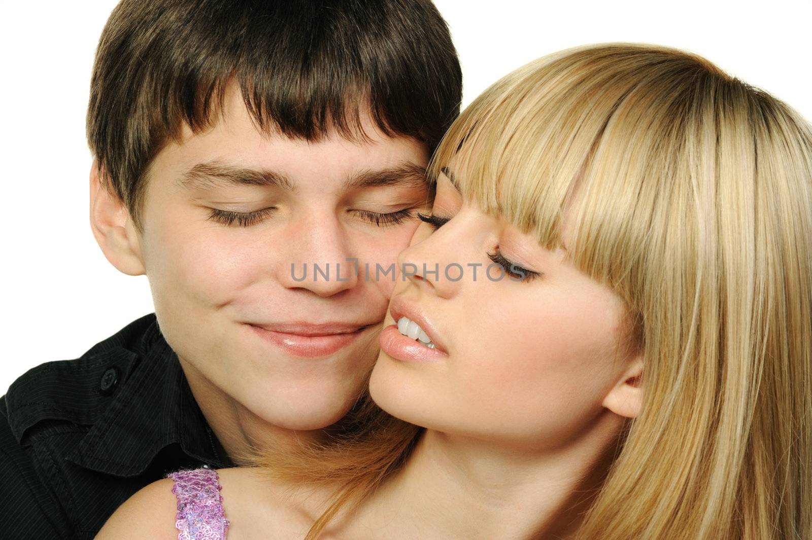 Young enamoured pair. It is isolated on a white background