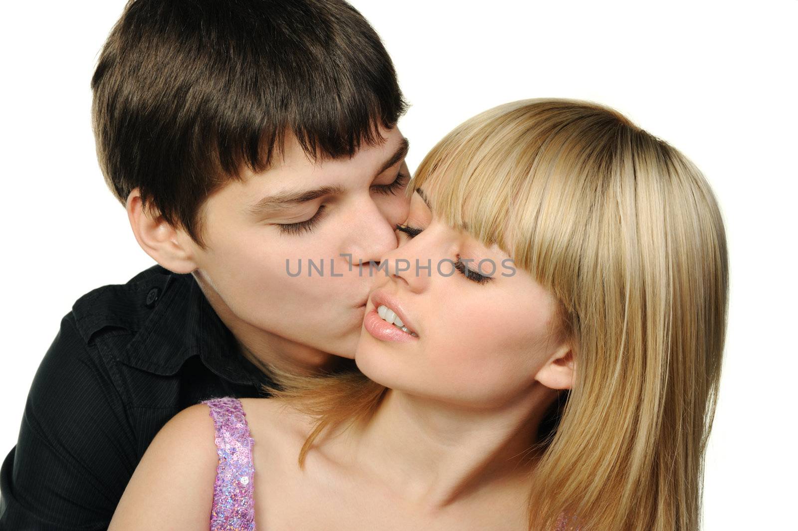 Young enamoured pair. It is isolated on a white background