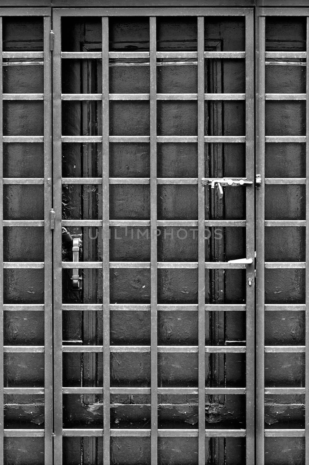 Wooden door and protective metal frame.