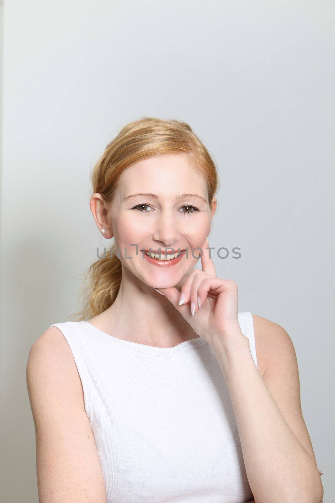 Portait of a young, smiling woman - portrait format