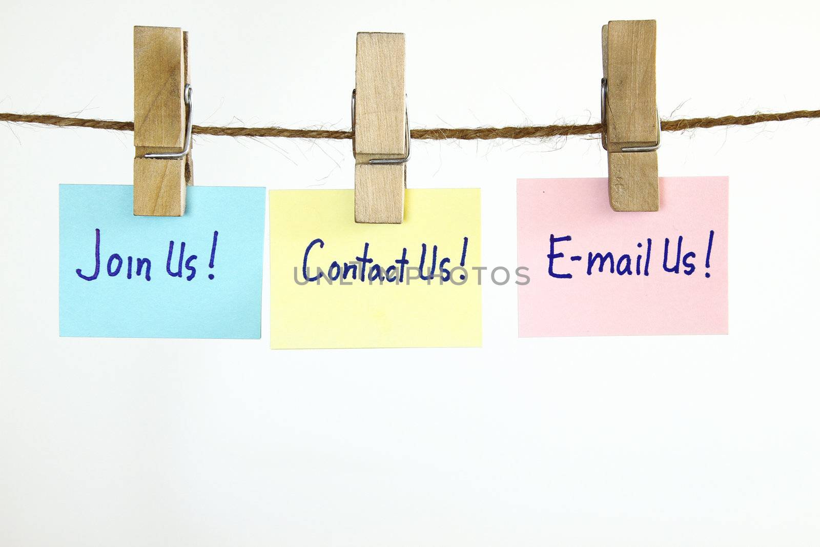 Contact us, Email us, Join us message on post notes hanging isolated on white.