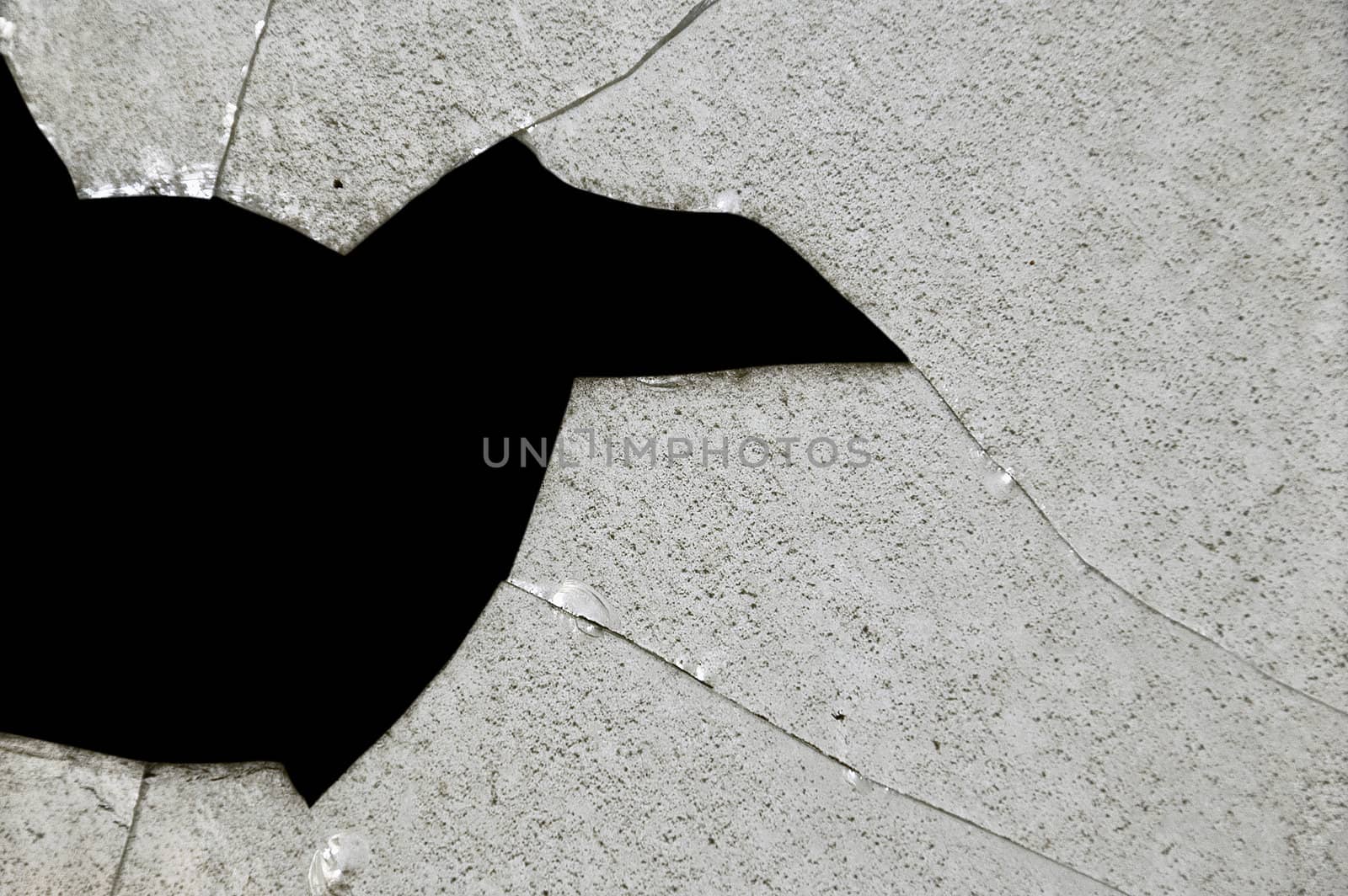 Broken glass fragments surface texture. Abstract background.