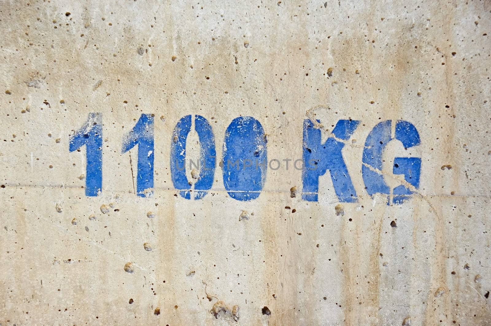 Concrete counterweight block used in building construction.