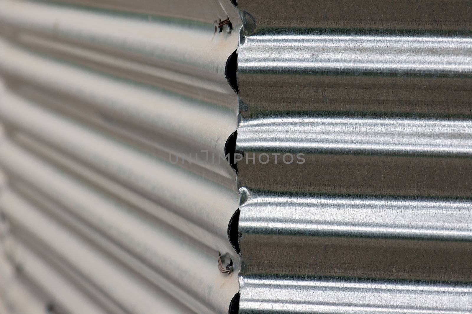 Corrugated metal fence abstract background. Selective focus.