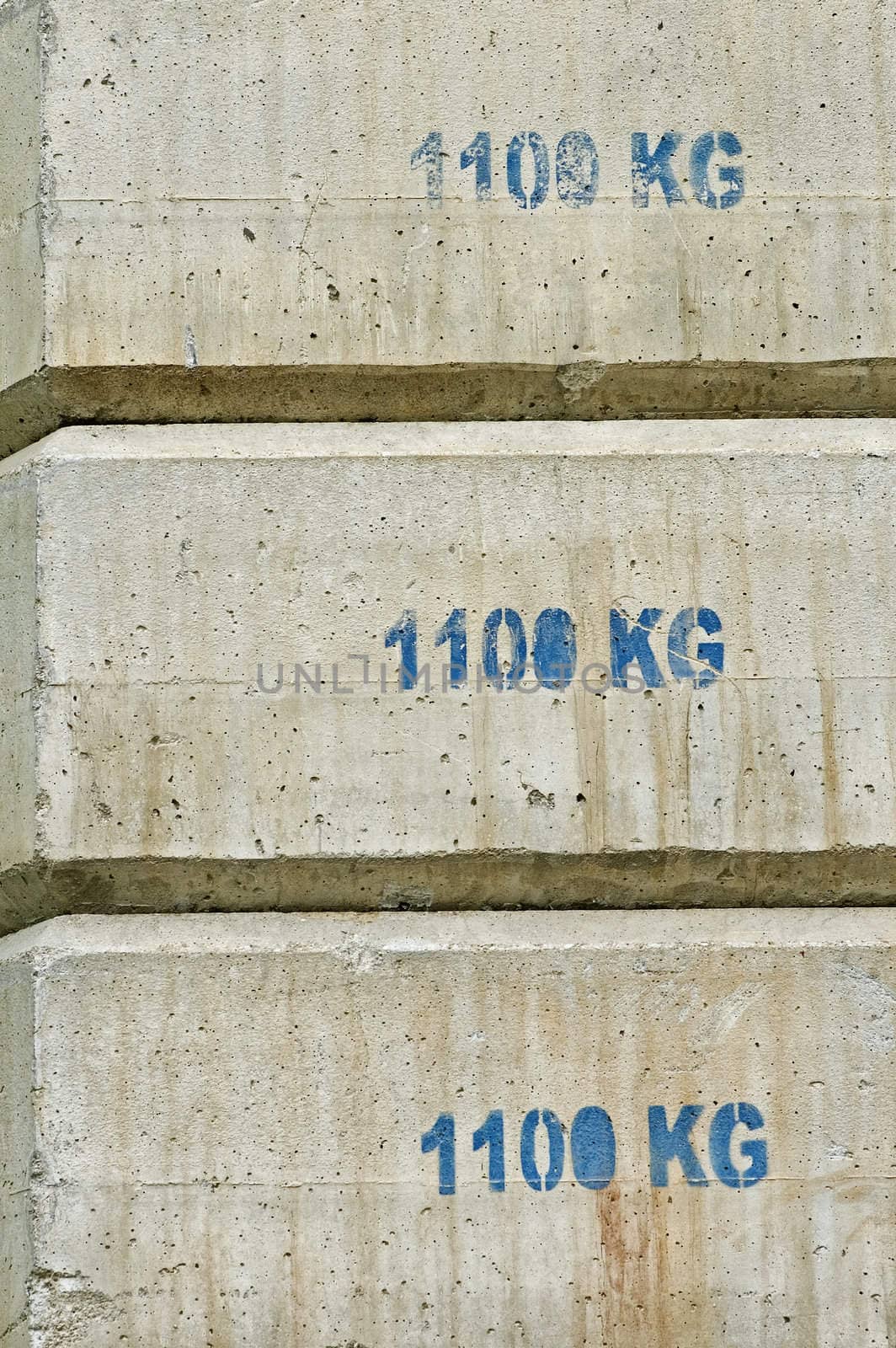 Concrete counterweight blocks used in building construction.
