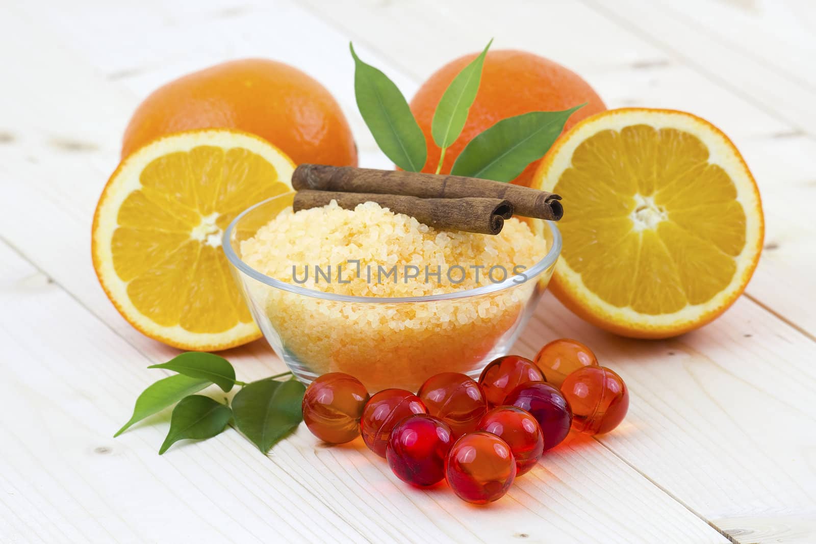 bowl of orange bath salt with fresh fruits - beauty treatment