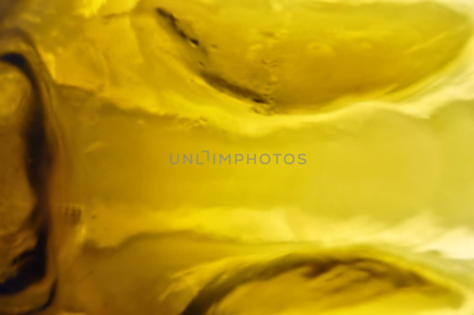 Yellow glass reflections macro. Abstract background pattern.