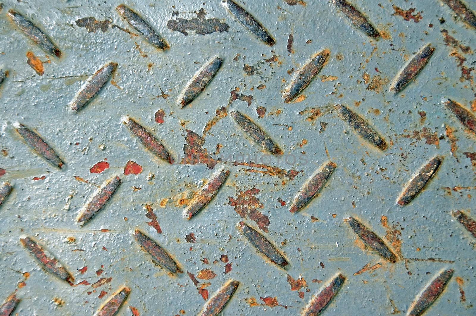 Rusty chipped paint industrial anti slip metal texture.