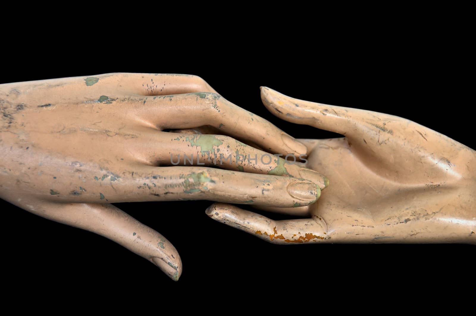 Weathered hands of plastic mannequin doll.