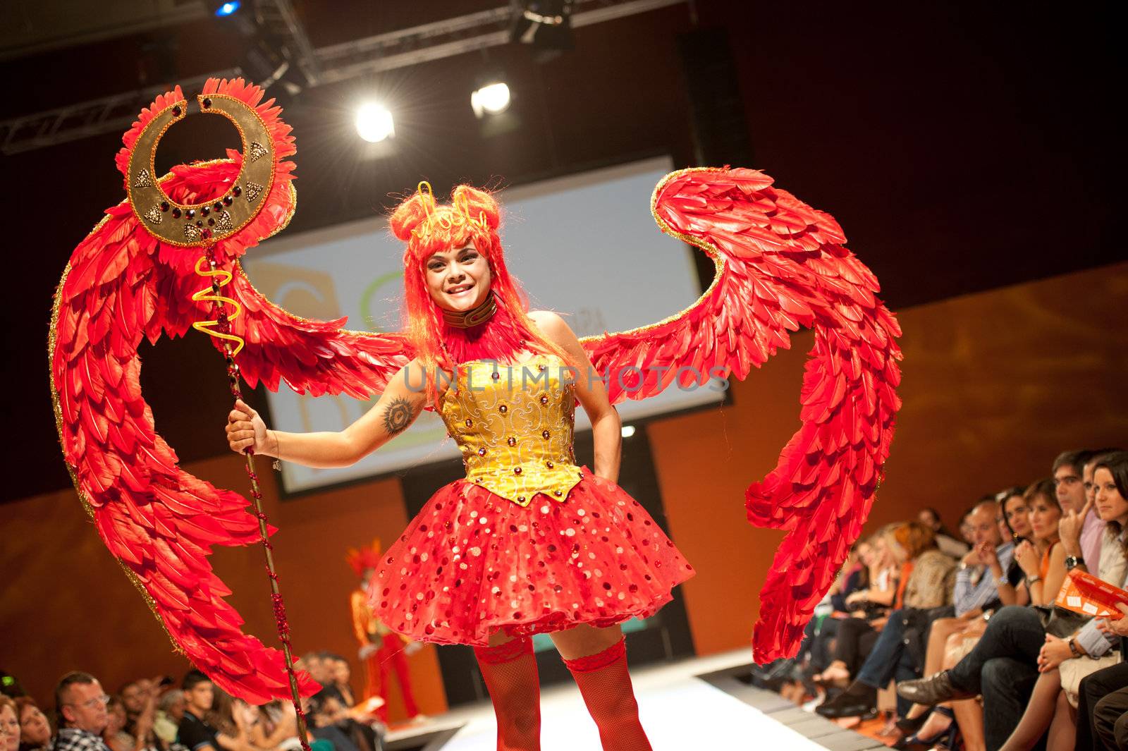 CANARY ISLANDS - 29 OCTOBER: Model on the catwalk wearing carnival costume from designer GC DC during Carnival Fashion Week October 29, 2011 in Canary Islands, Spain