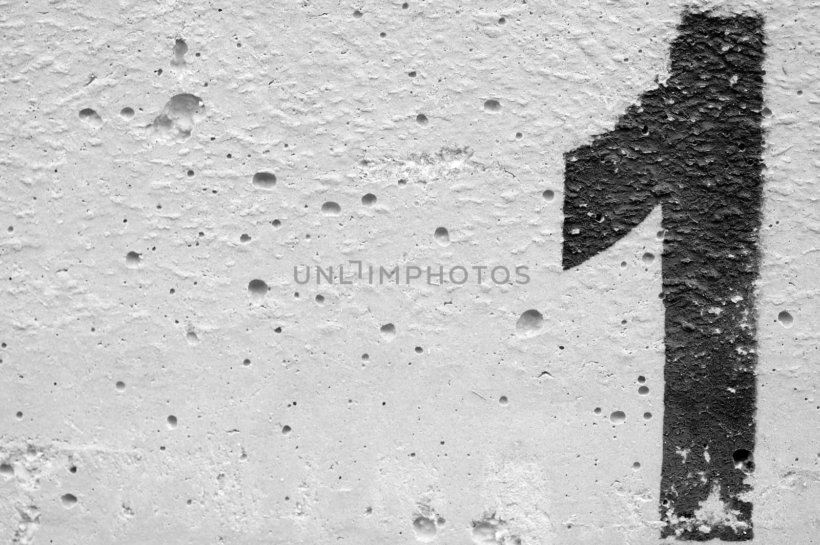 Number one stencil sprayed on rough concrete surface. Black and white.