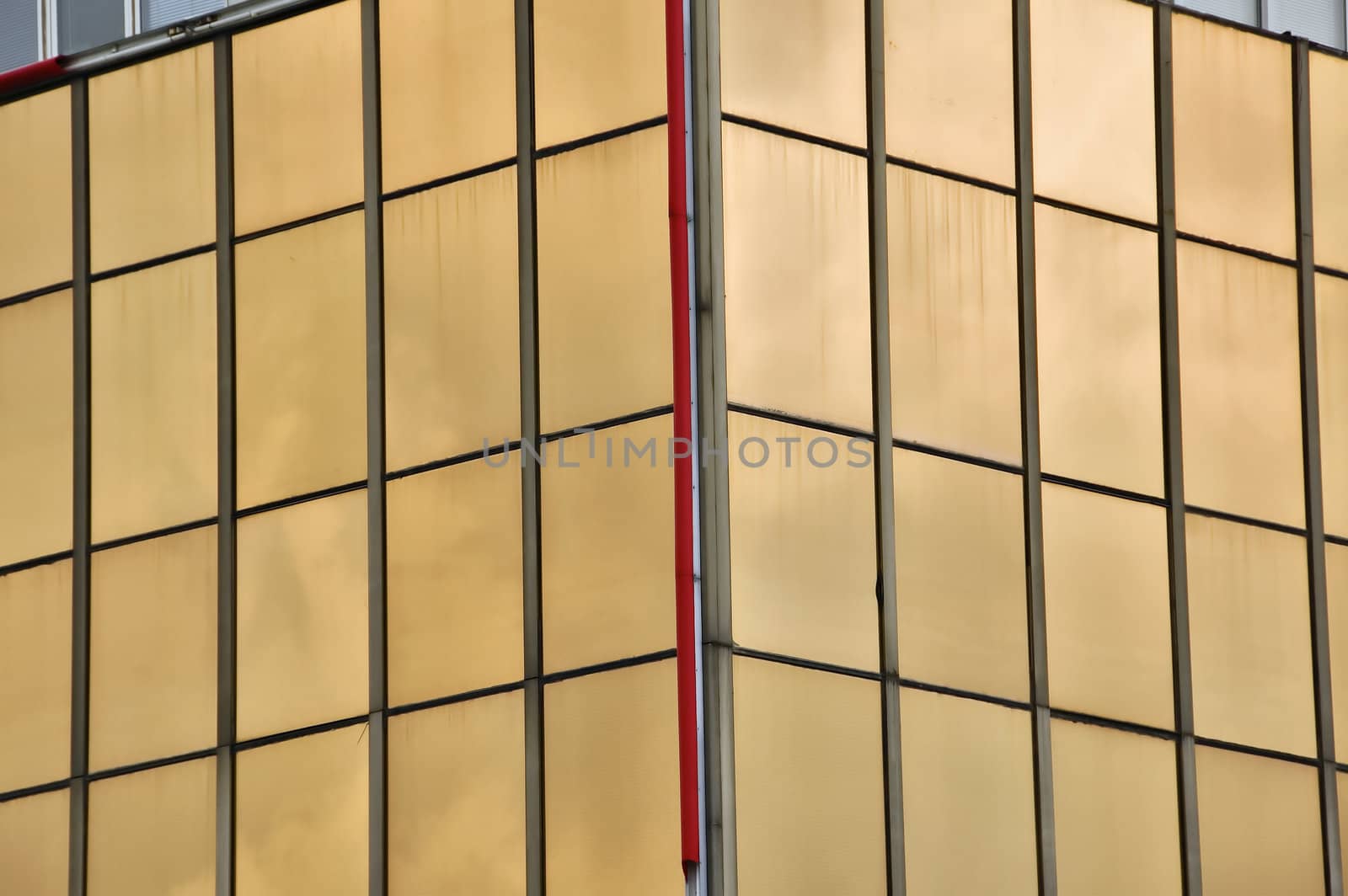 Glass windows facade of a modern office building. Architectural detail.