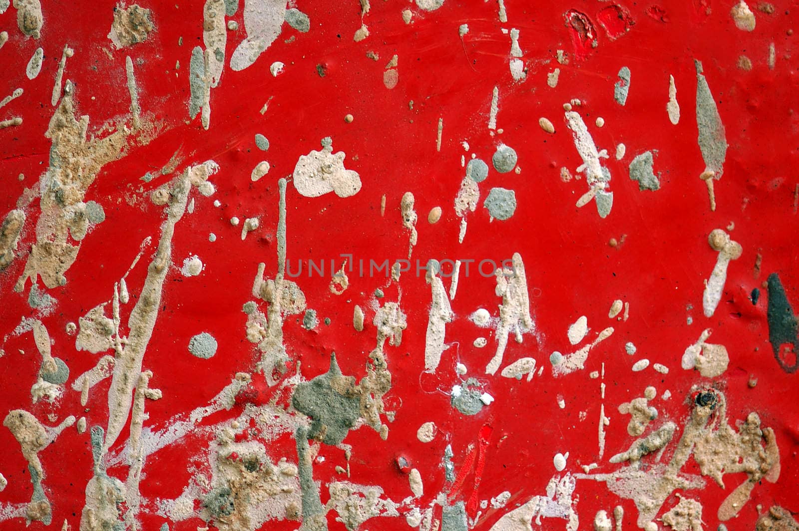 Metal sheeting texture detail with paint and cement stains.