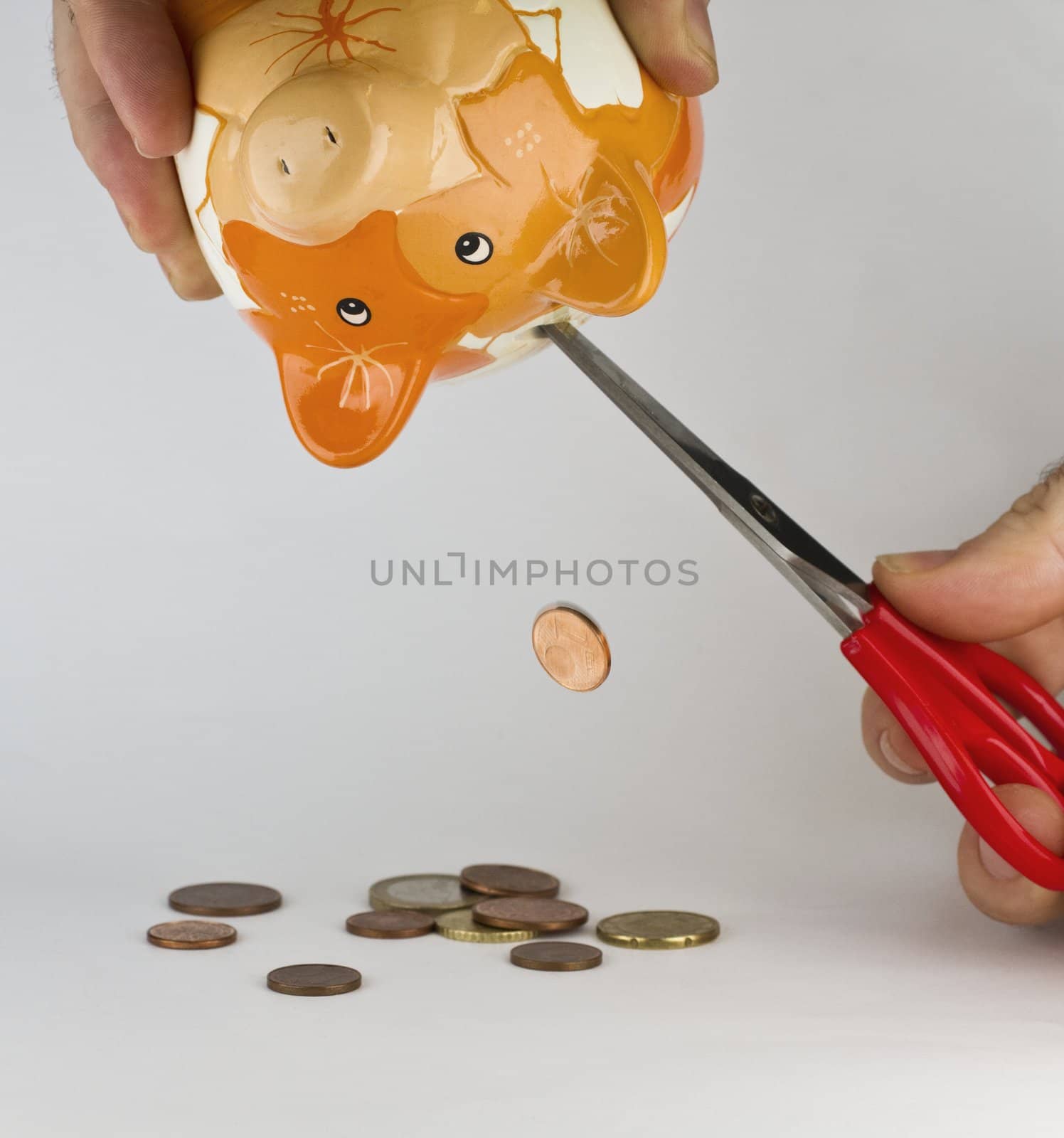 getting money out of piggybank with a cutter. Synonym for financial straits or shortage of money