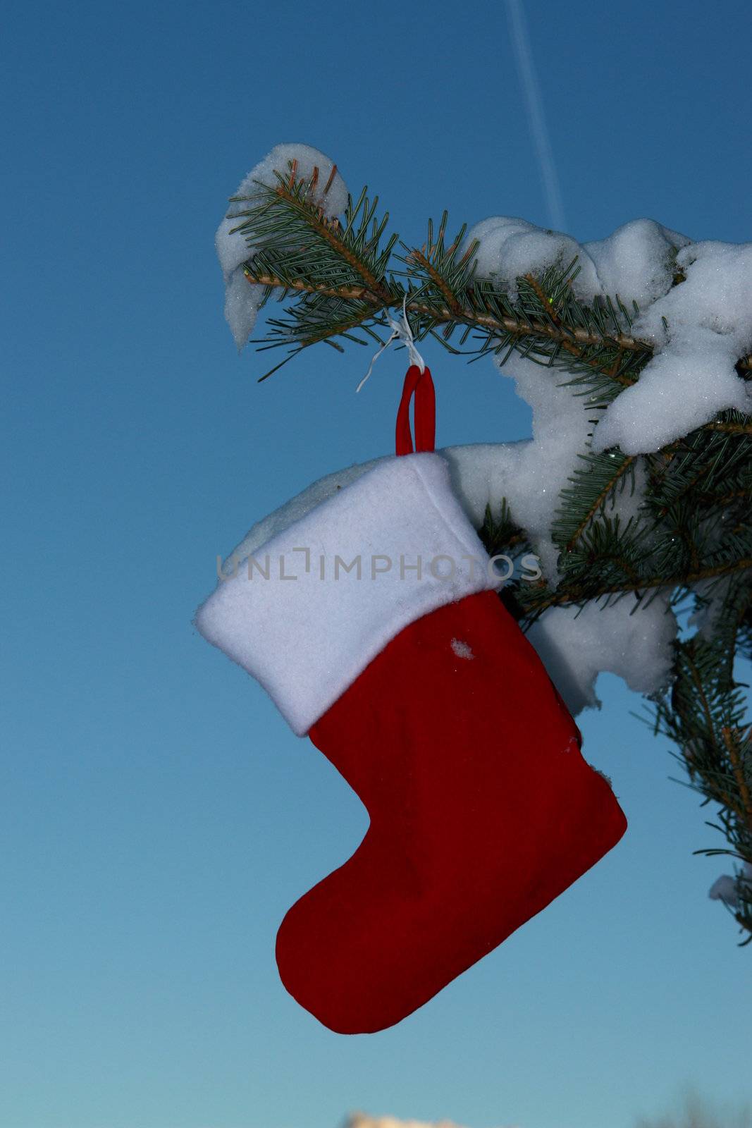 Santa Claus Christmas boot for gifts outside in a snowy landscape