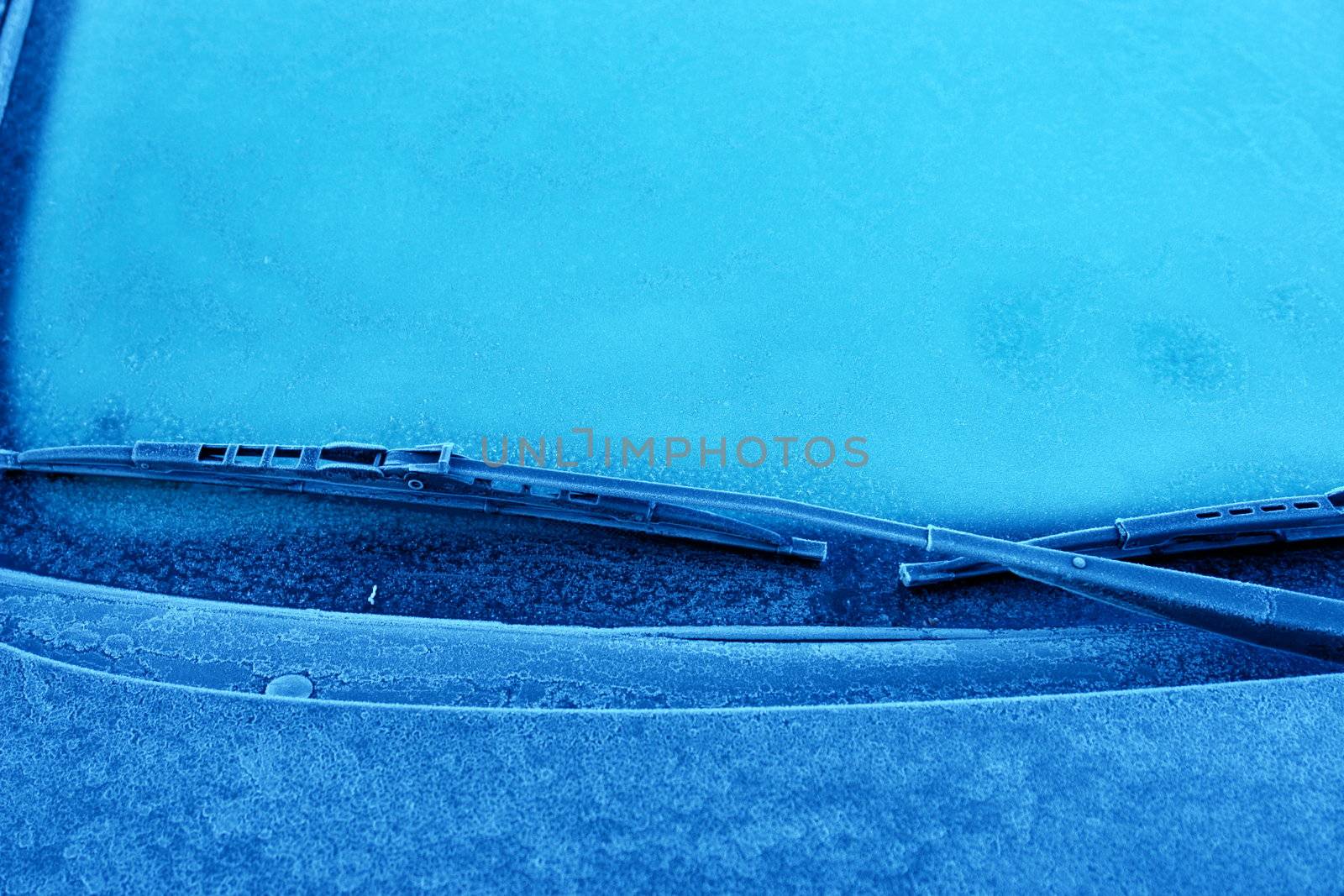 car windshield covered with ice and snow