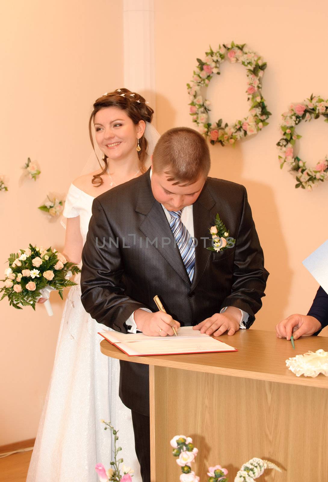 The wedding signature. Ceremony of wedding, a fastening the signature