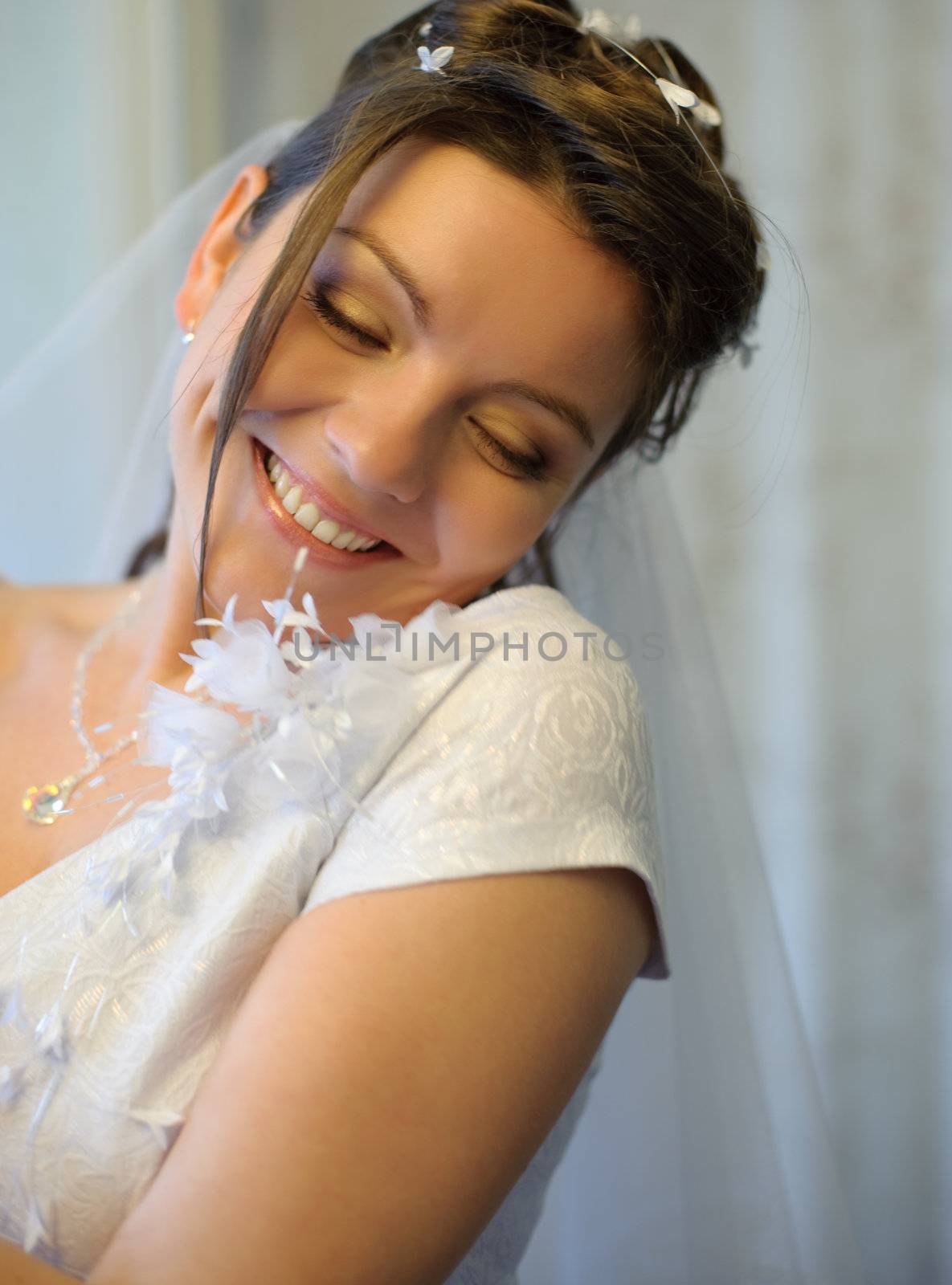 The bride. The young girl in a wedding dress on an abstract background