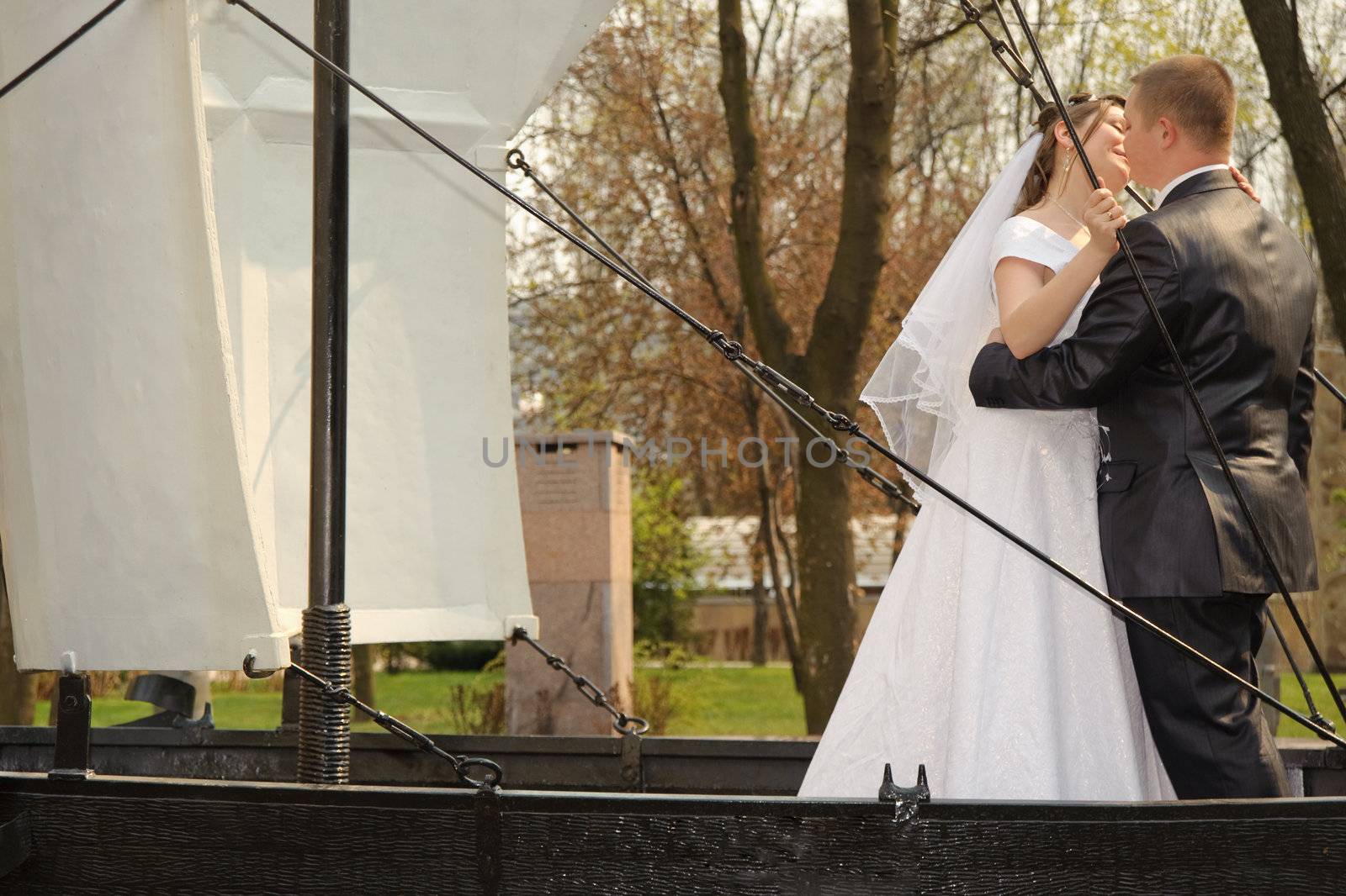 Newly-married couple. Pair young men in wedding day