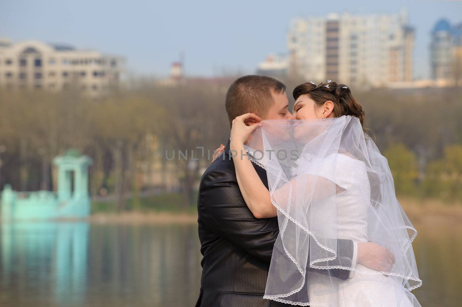 Newly-married couple. Pair young men in wedding day