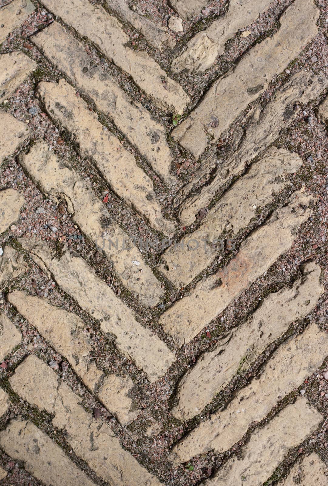 Stone pattern on land roadway in the manner of background