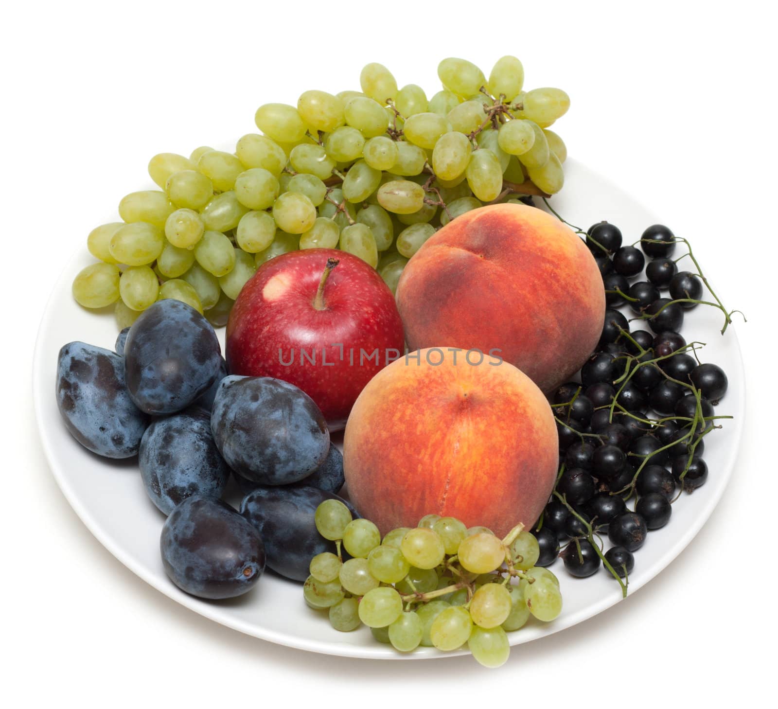 Still life, plate with fruit peaches grape discharges currant