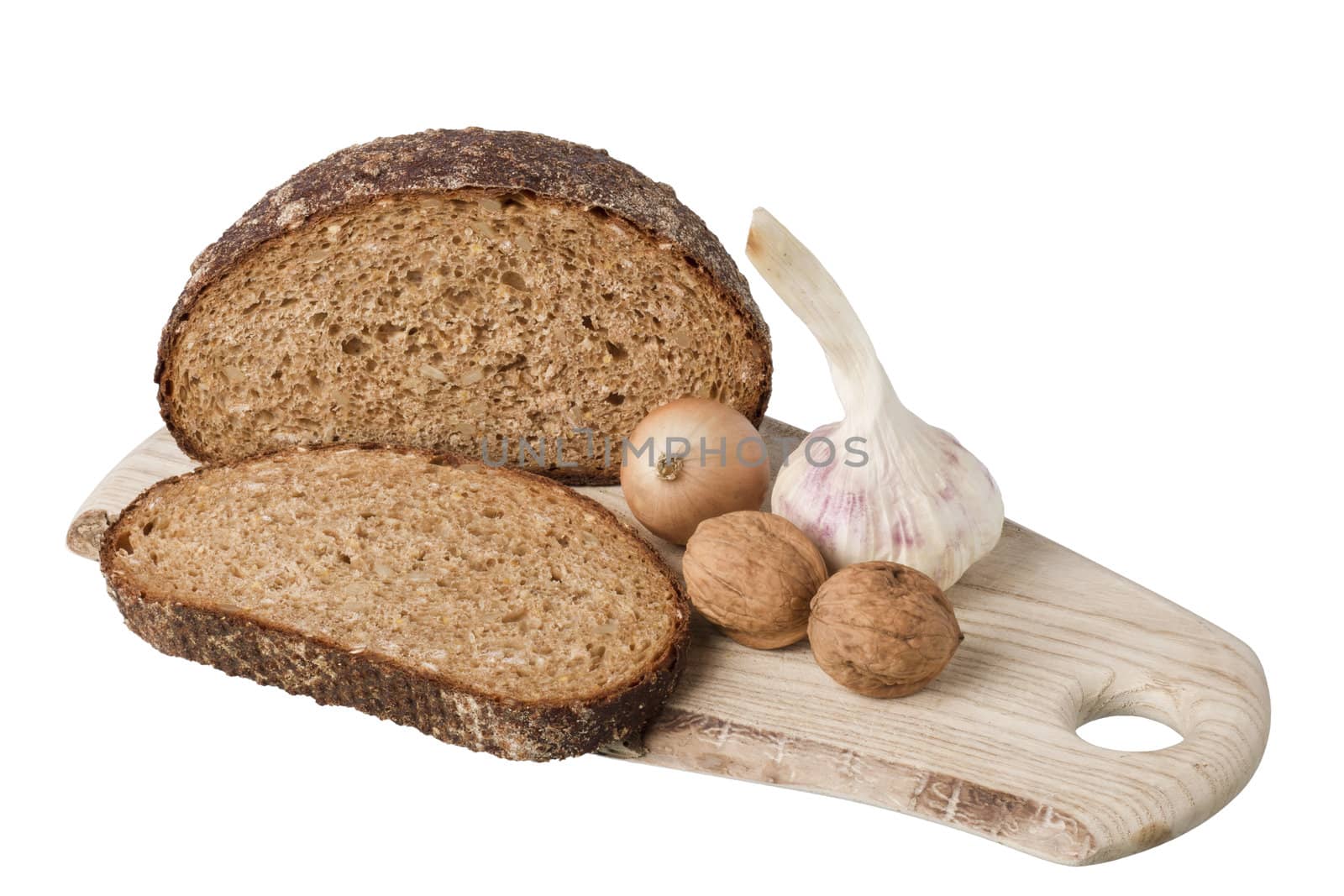brown bread on shelf with onion, garlic and walnut by gewoldi
