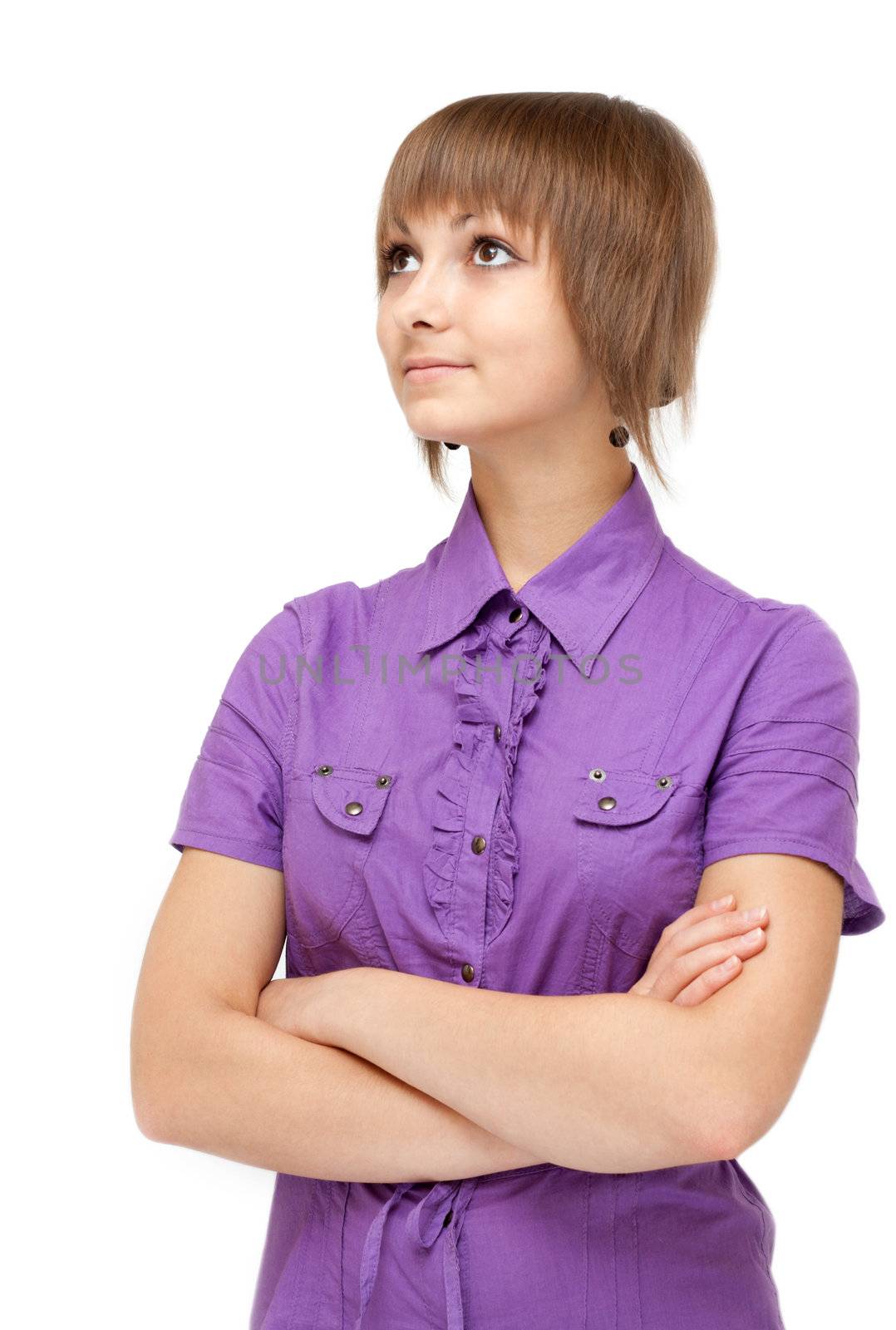 Young girl in violet blouse smiles on white background