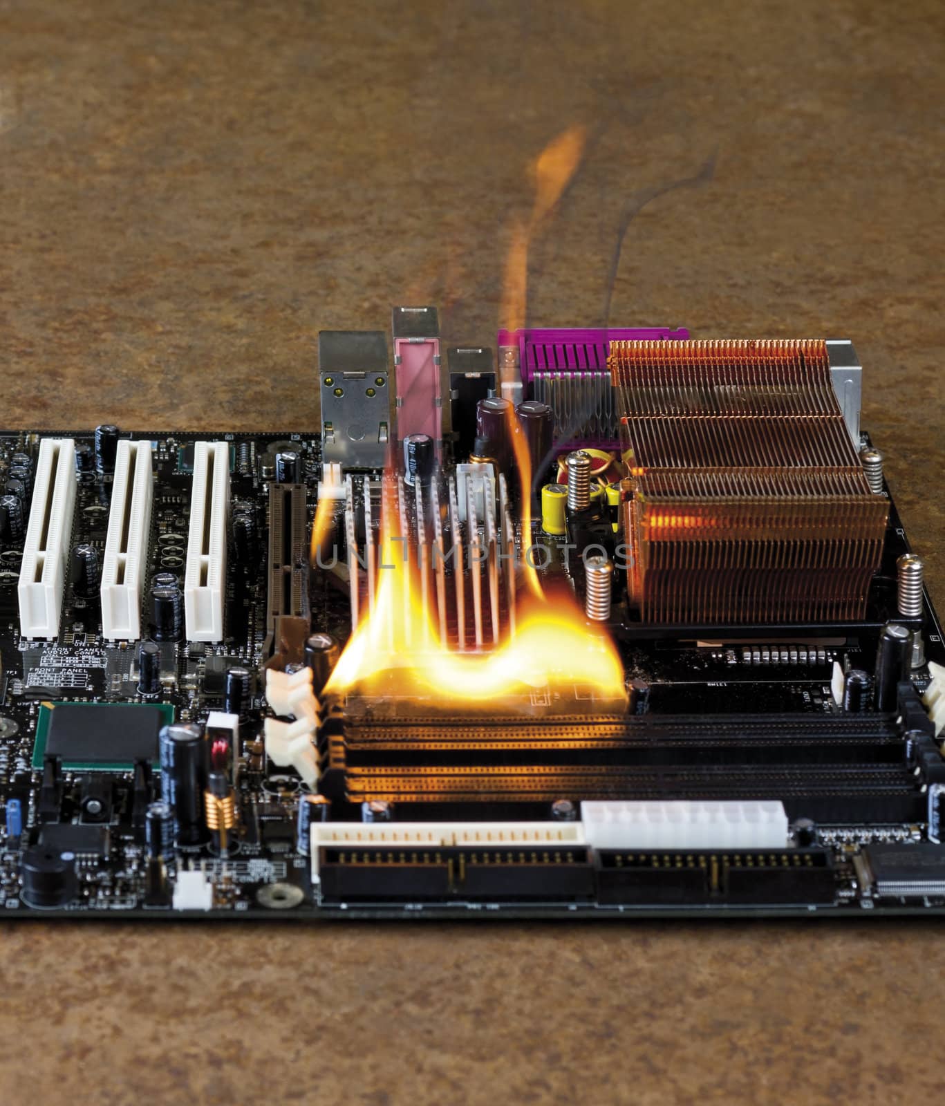 burning computer main board in rusty background