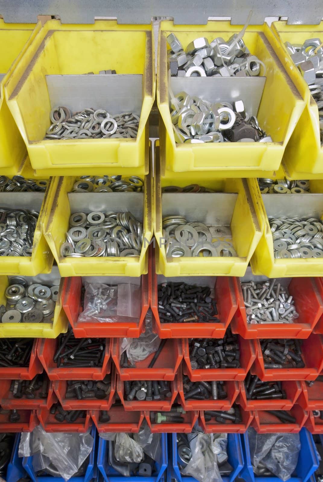 screws and nuts in colored boxes.top angle view