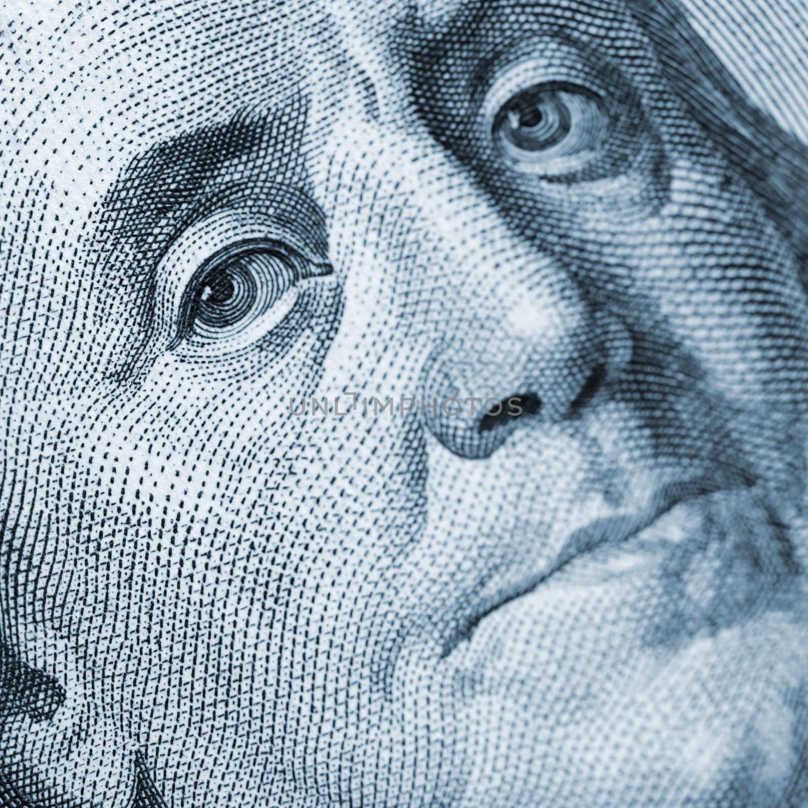 Franklin portrait closeup blue color. A fragment of a photo hundred dollar denominations