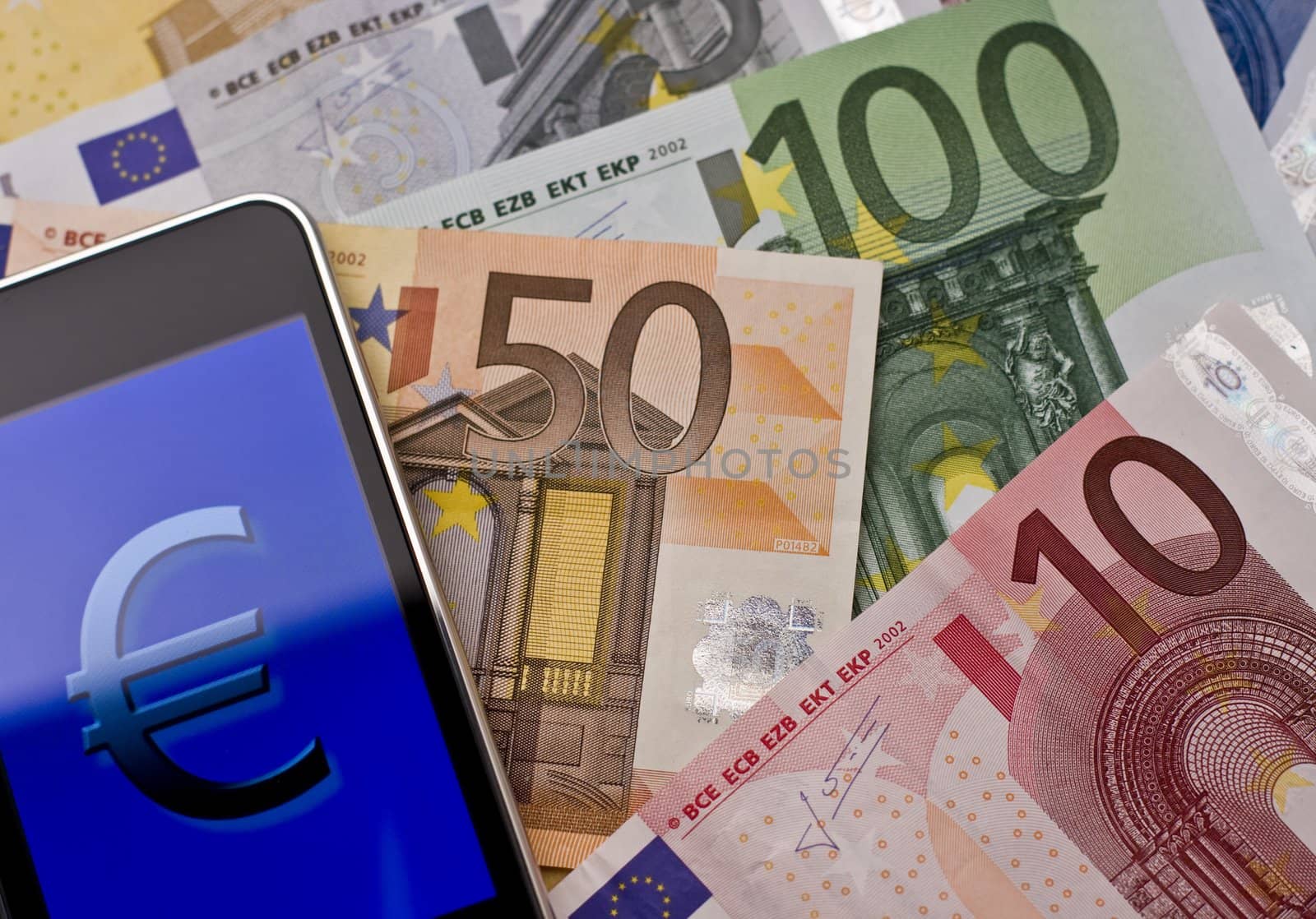 handheld with euro sign on european banknotes