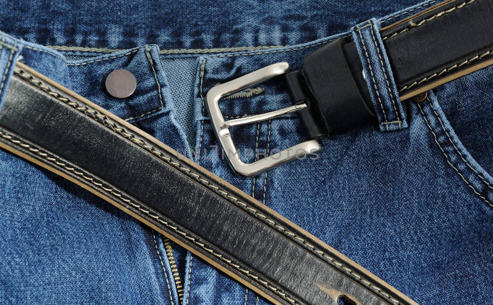 Jeans. A fragment trousers - jeans, with a leather belt