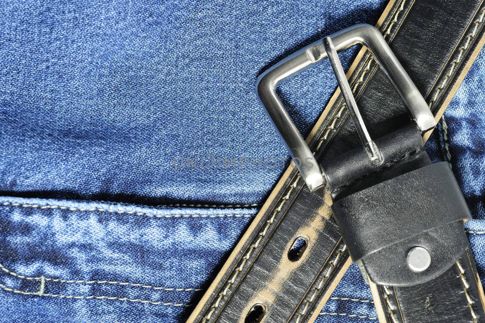 Jeans. A fragment trousers - jeans, with a leather belt