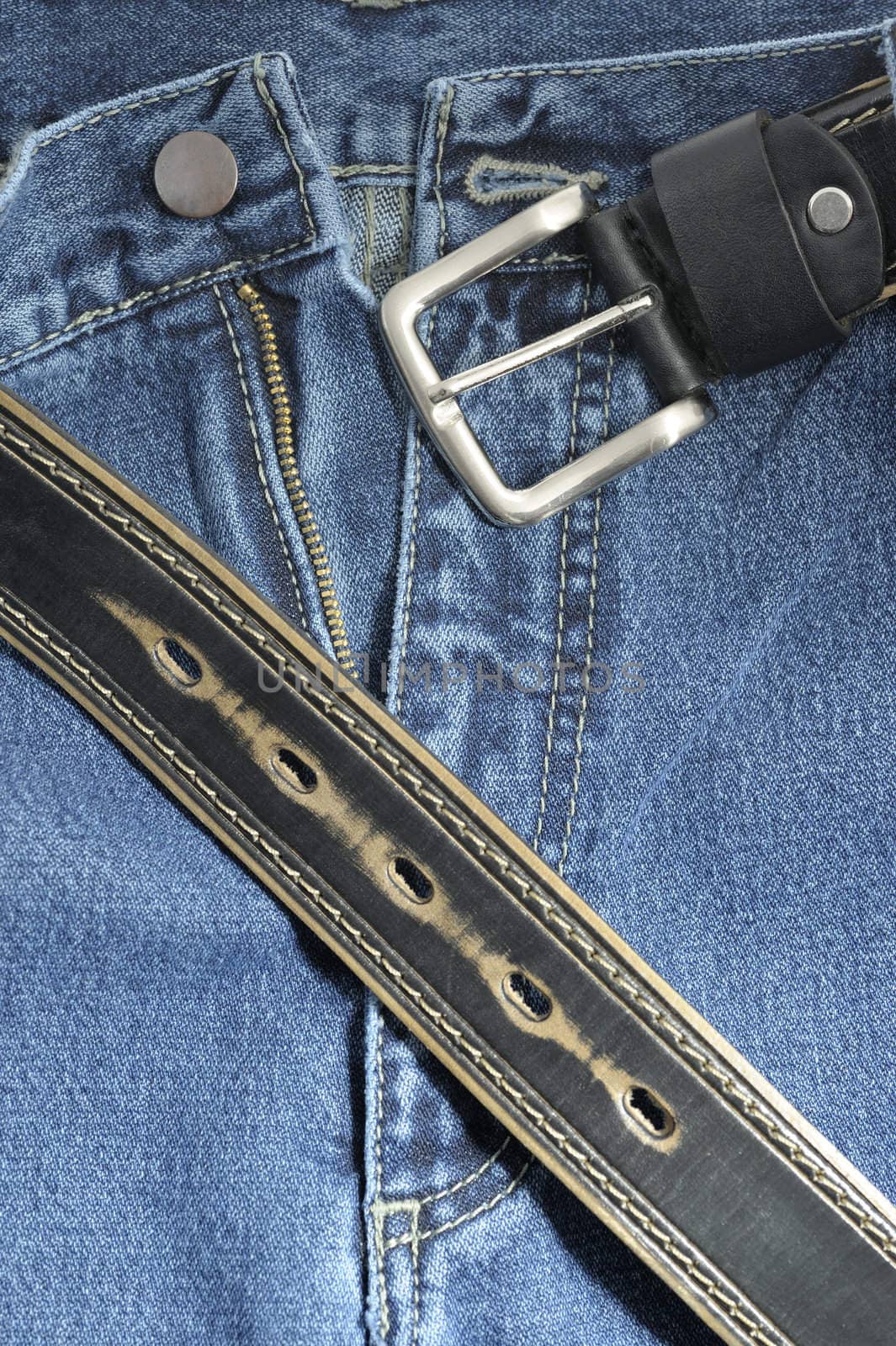 Jeans. A fragment trousers - jeans, with a leather belt