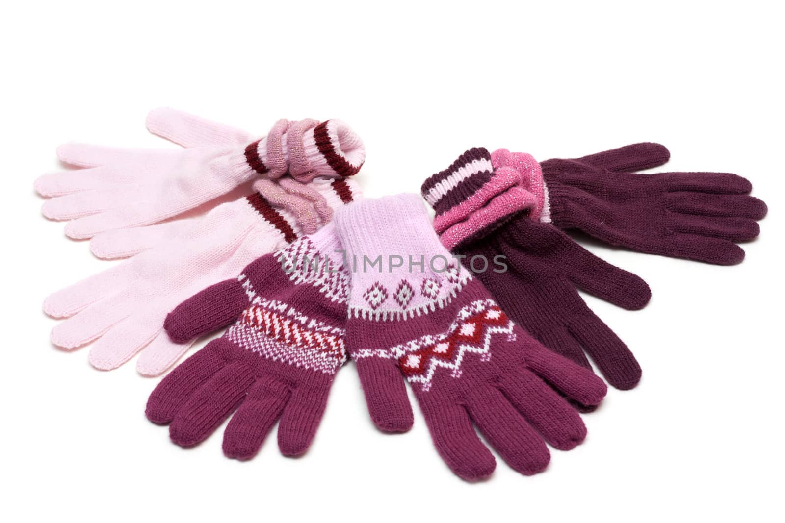 Striped much pairs of the gloves on white background