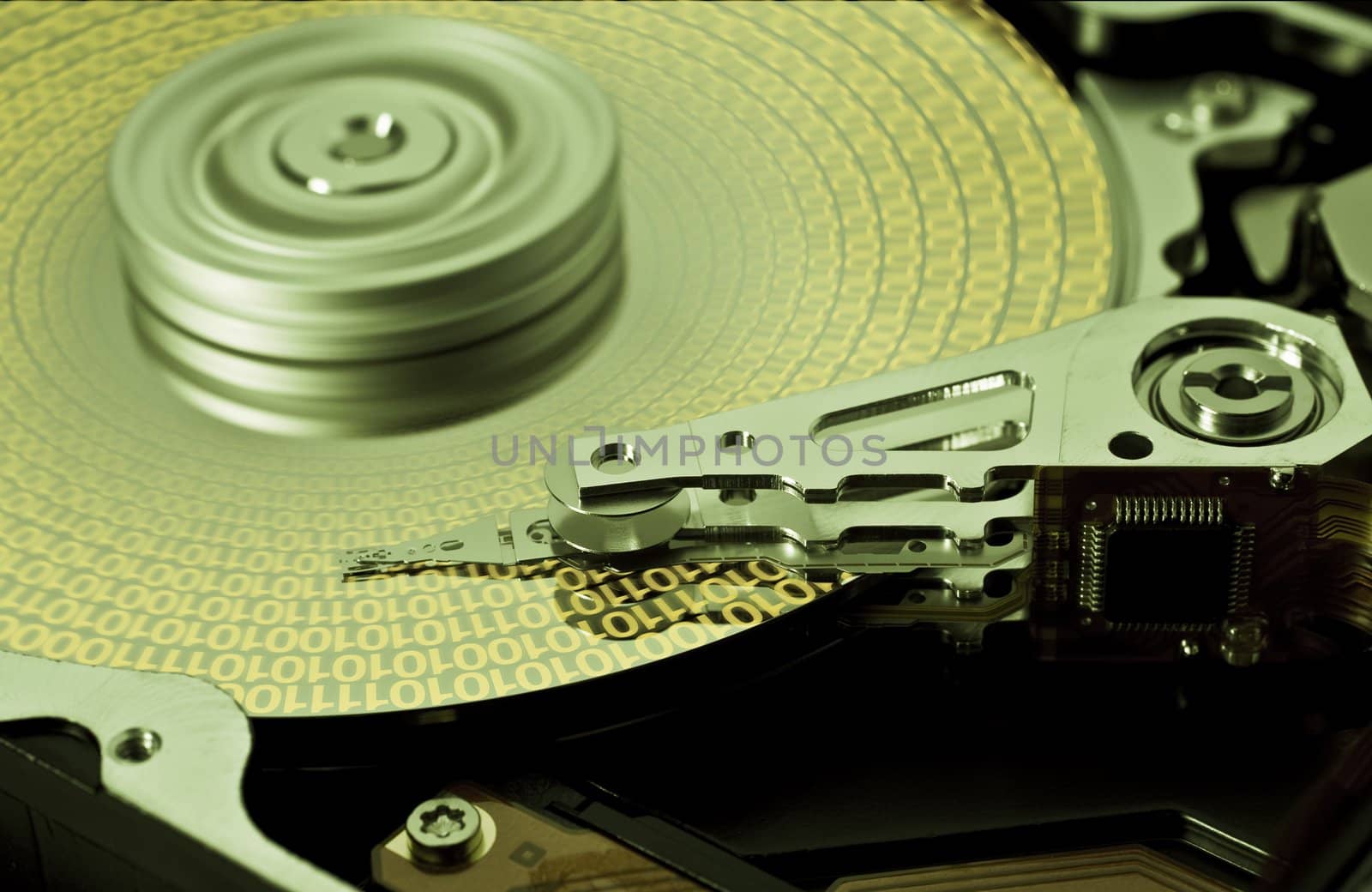open hard disk drive with yellow data in close up
