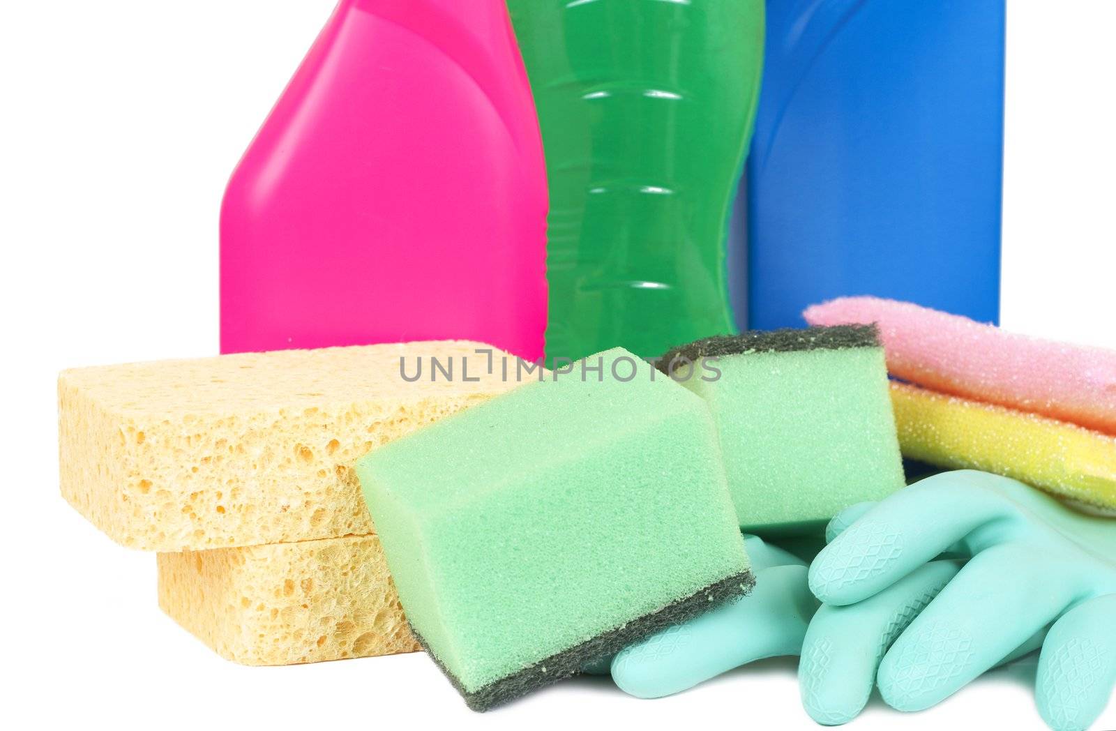 Variety of cleaning products such as sponges, gloves, and bottles with chemicals isolated on white background