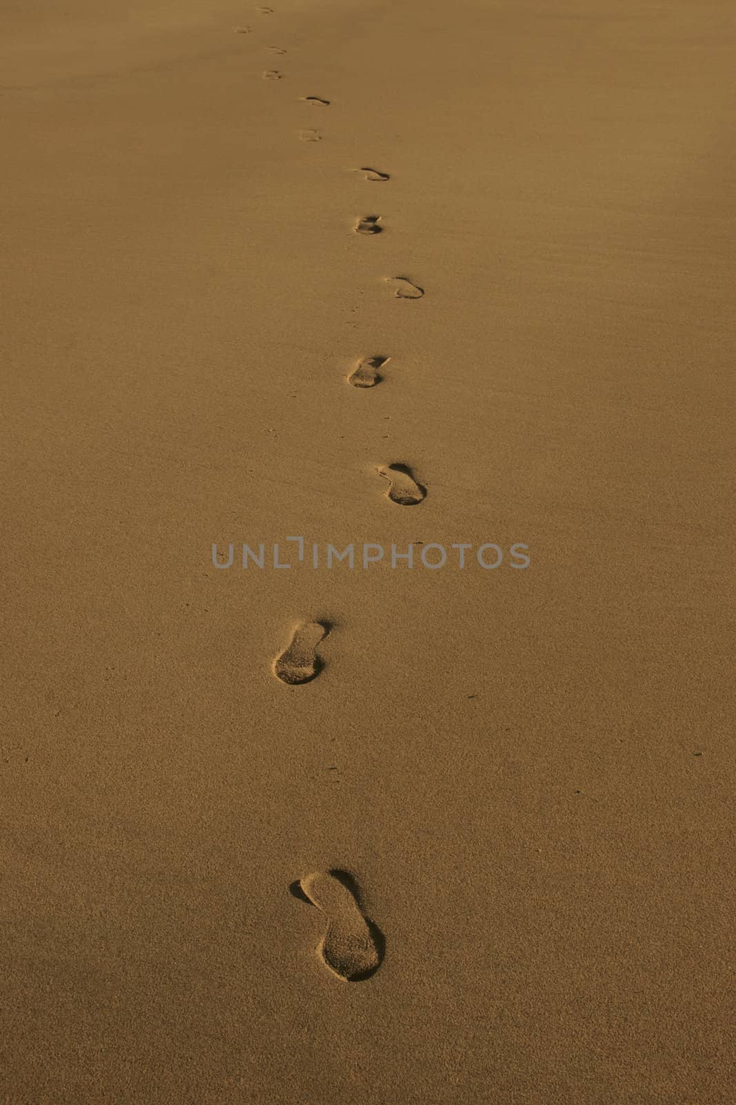 footprint tracks on a beach in ireland