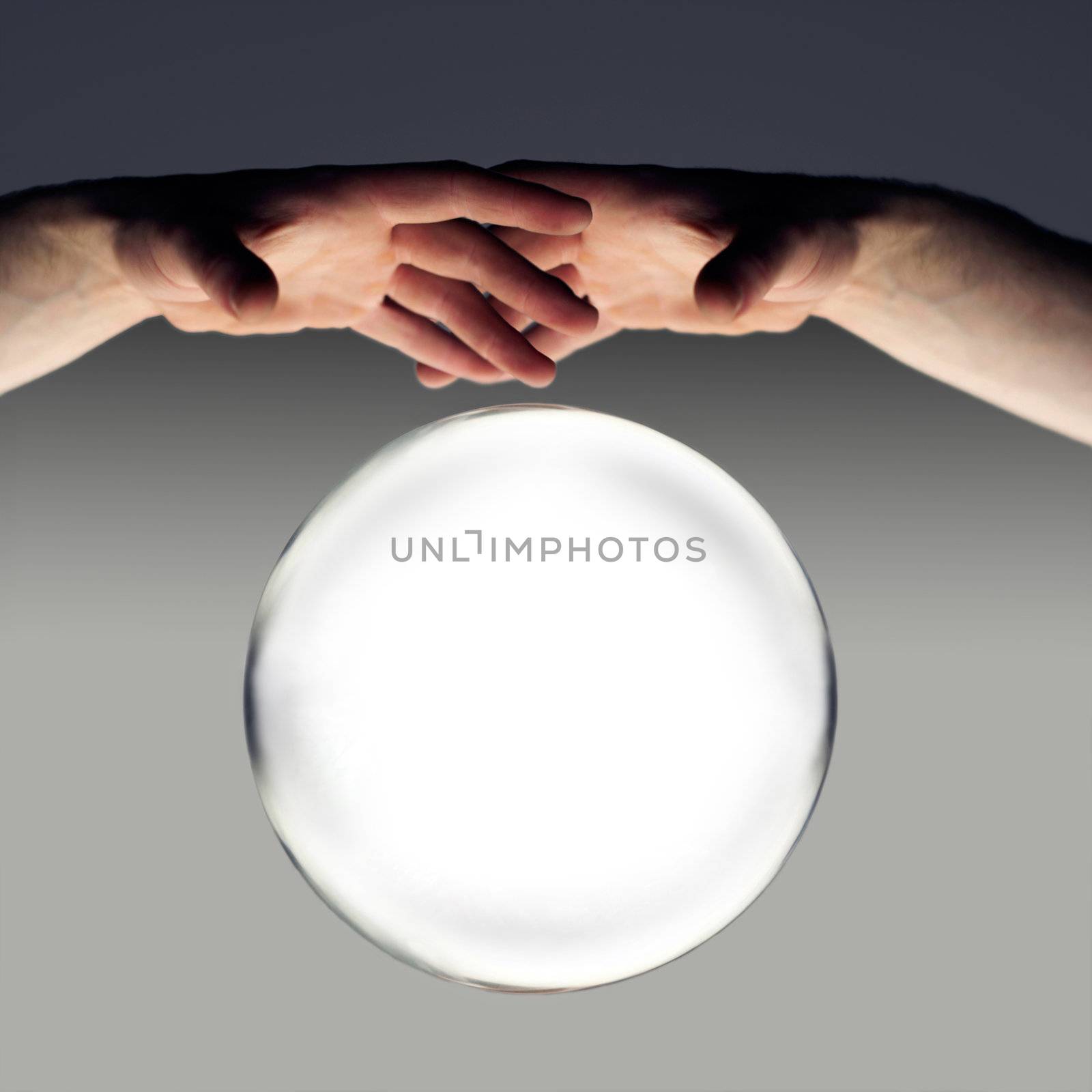 hands over a crystal ball of fortune with a clipping path