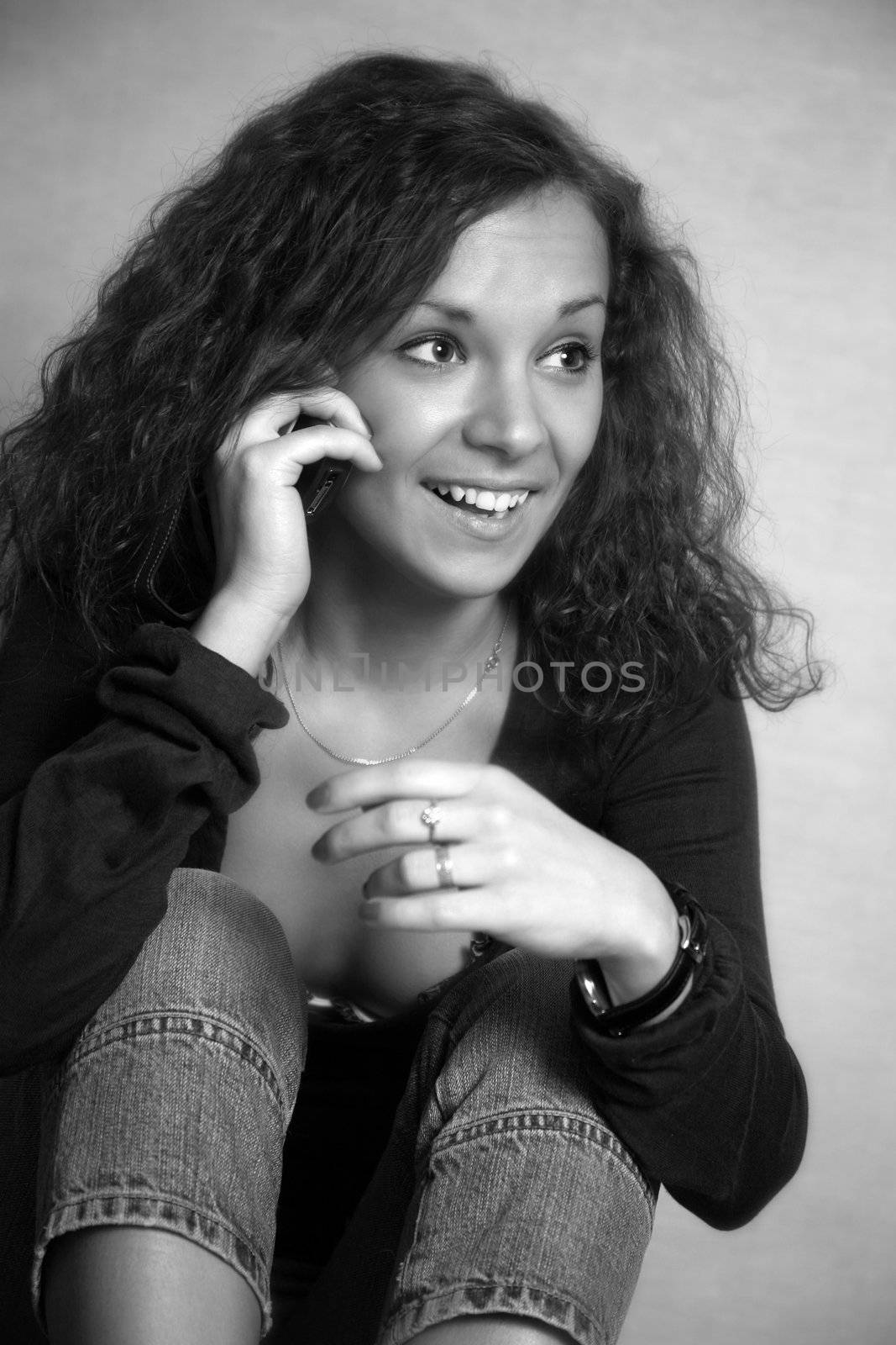 Pretty smiling brunette with the phone