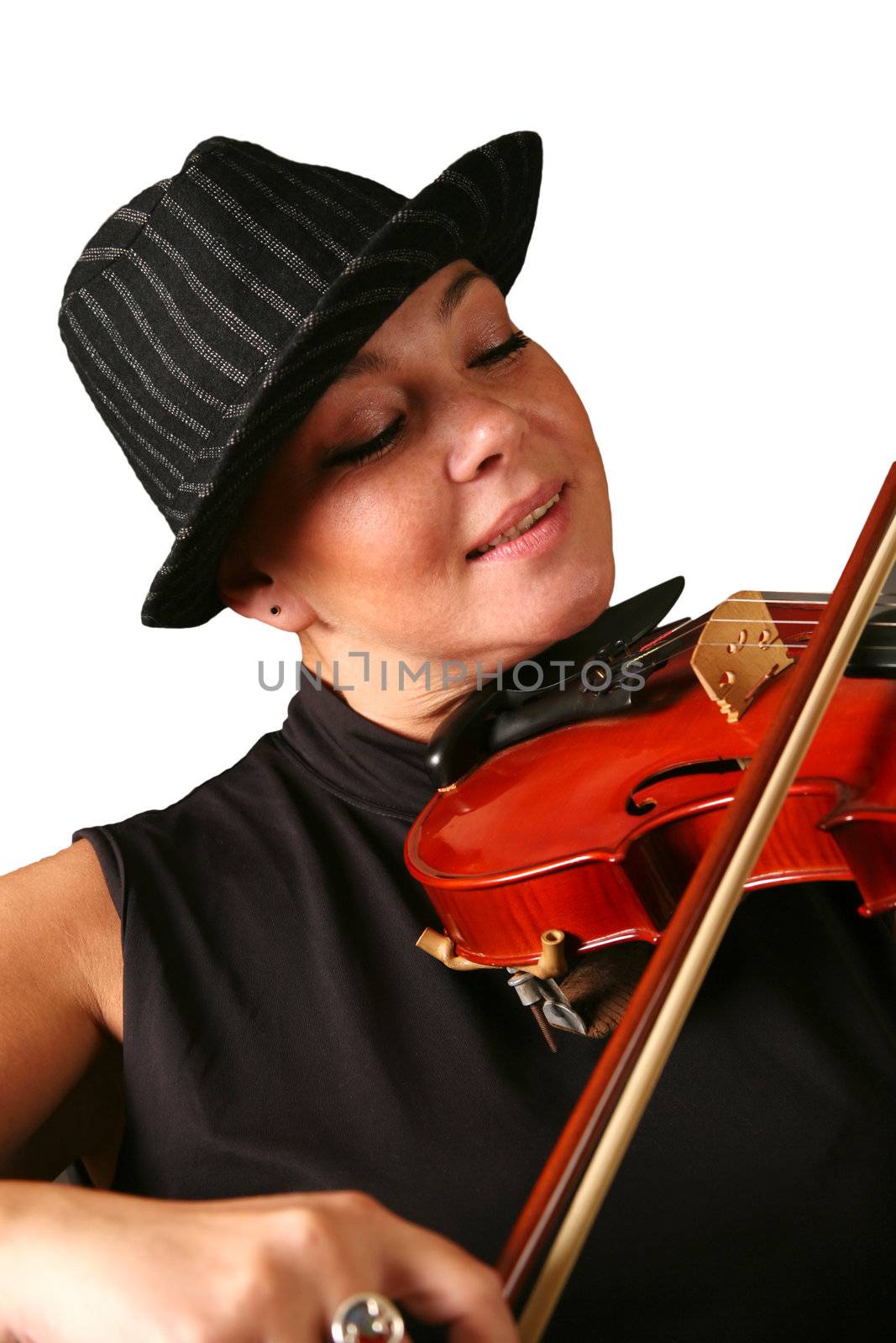 The woman in a hat playing its violin with a smile